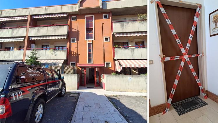 Il condominio e la porta dell'appartamento nel quale si è consumato il delitto