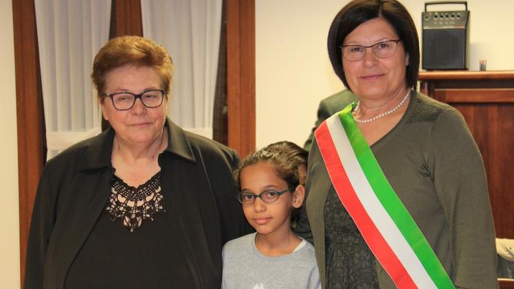 Iman El AsmaiyLorenza Merlin con la piccola Aya e il sindaco Loreta Isolani