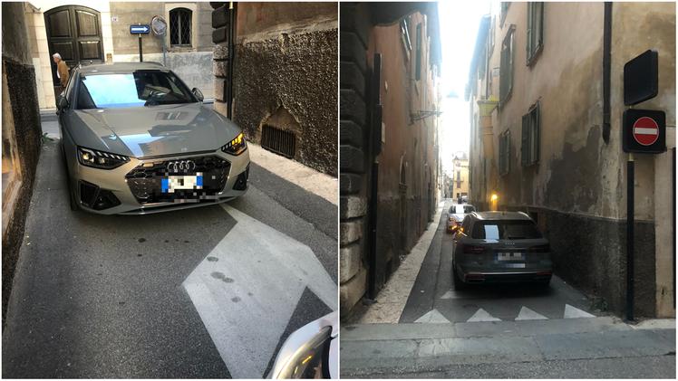 Due immagini dell'auto parcheggiata in contromano in vicolo San Giusto (Verona)